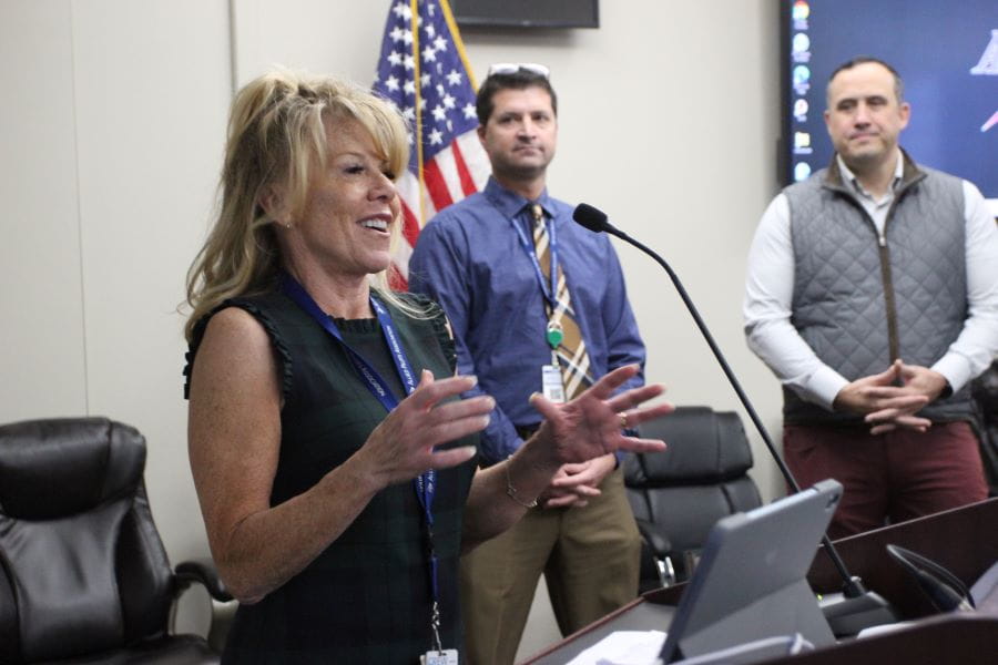 a woman speaking at a podium