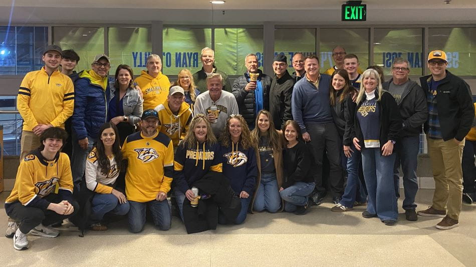 a group of people wearing Nashville Predators merchandise