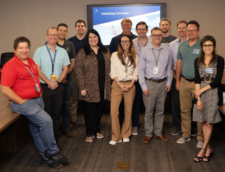a group of pilots in a conference room