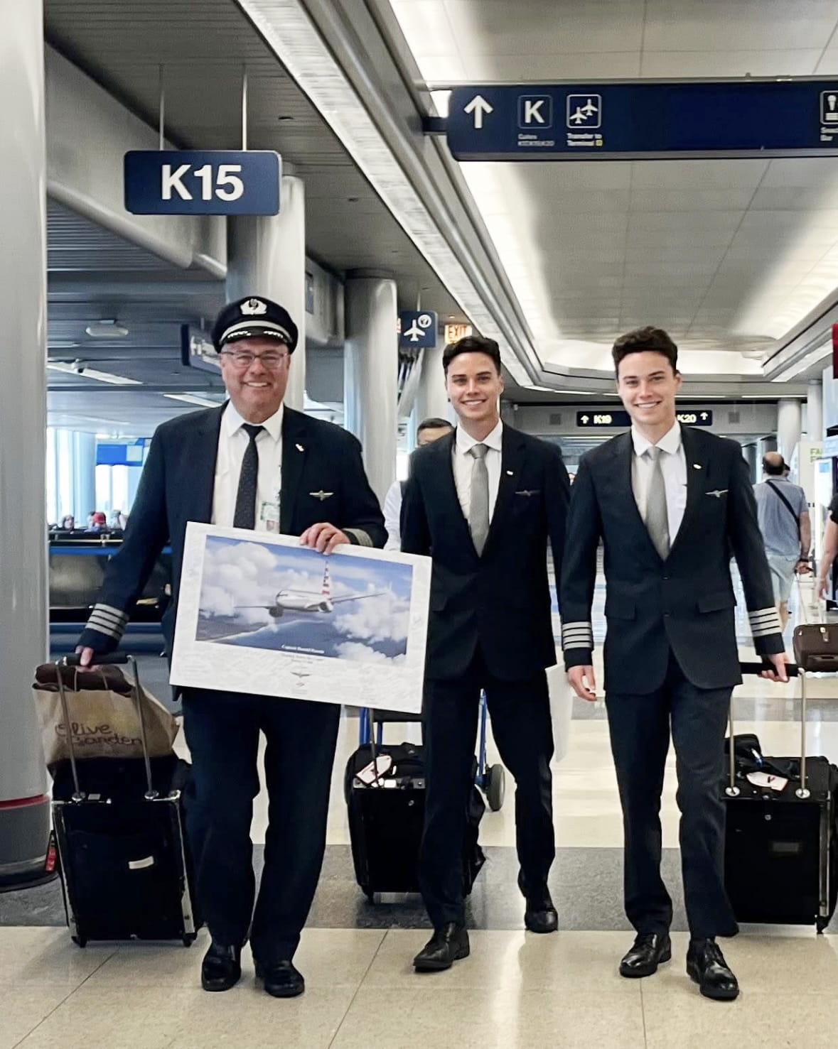 three airline pilots walking through a terminal