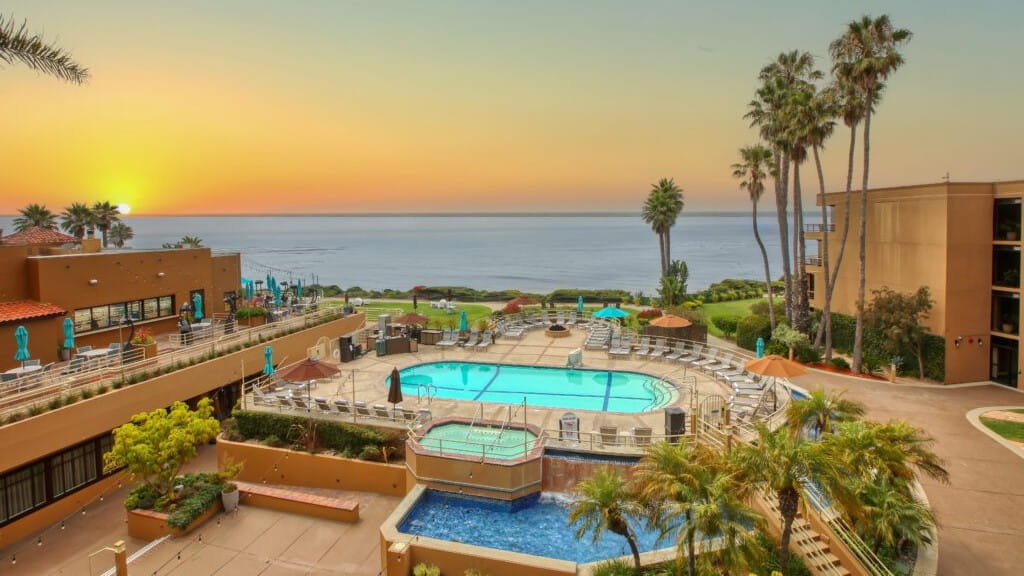 a hotel resort's pool by the Pacific Ocean